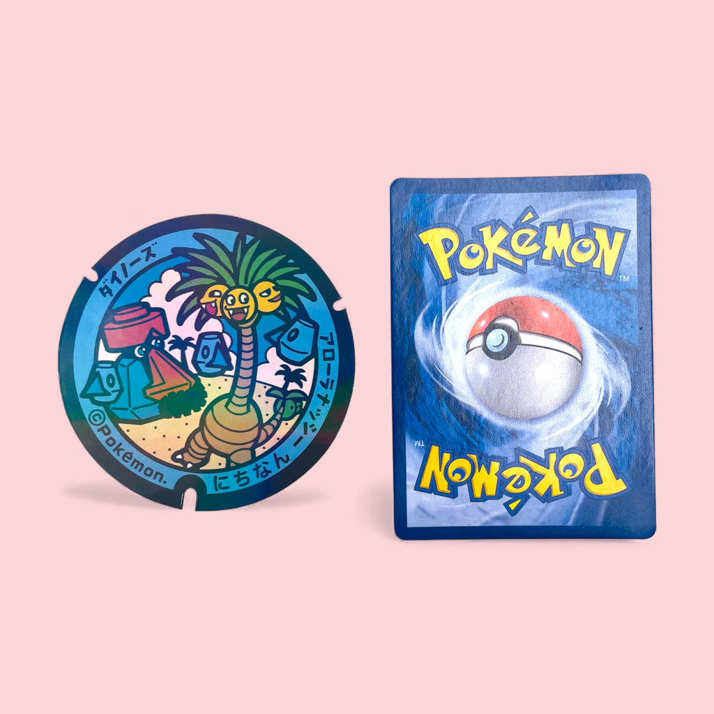 Alolan Exeggutor Poke-Lid Collector Decal Kawaii Alola Sticker next to Pokemon card