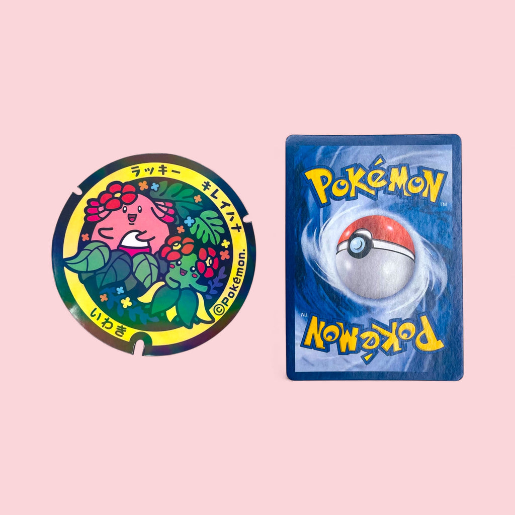 Chansey Pokelid Japan Holographic Sticker next to Pokemon card