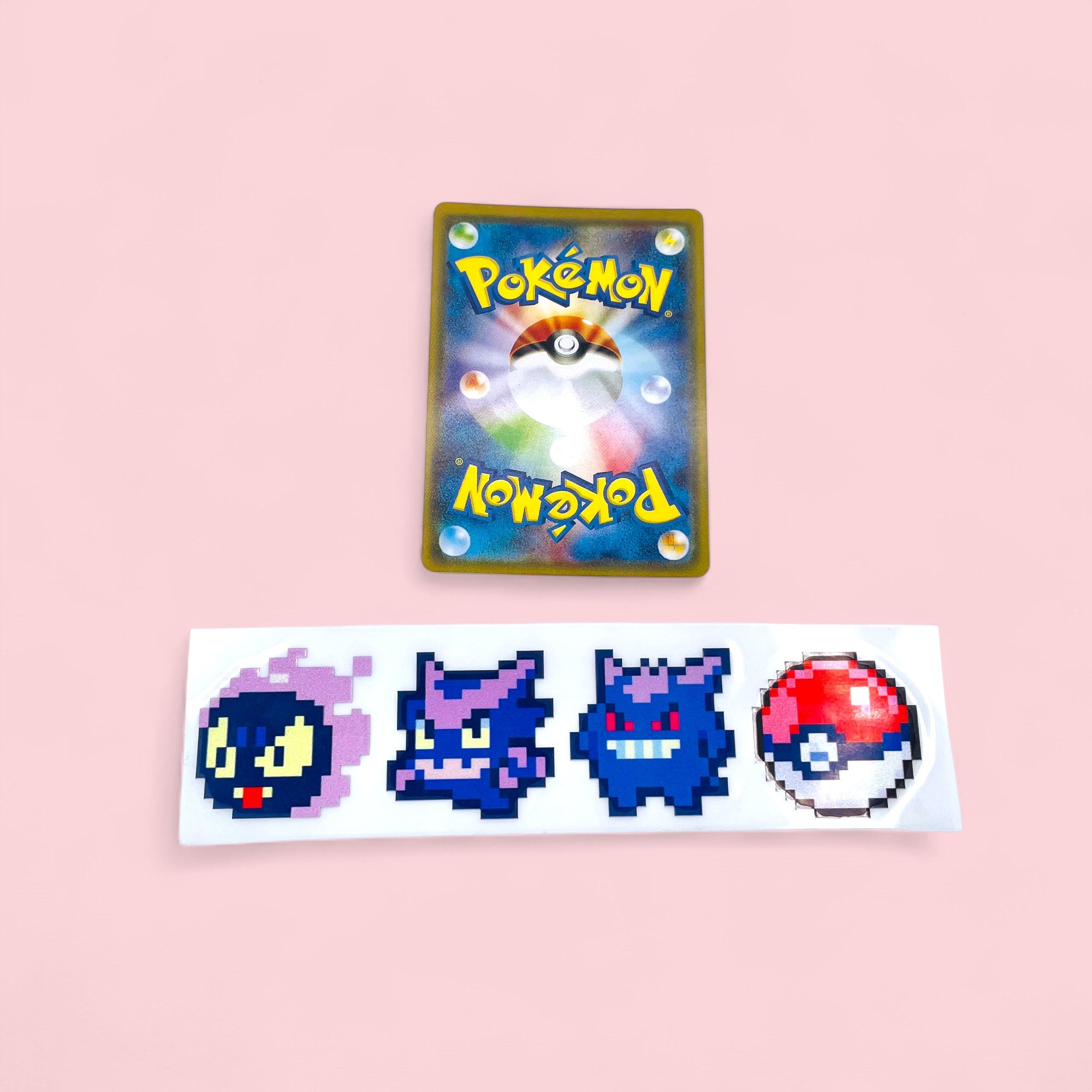 Gastly Haunter Gengar Evolution 8Bit Retro Pixel Vinyl Sticker next to Pokemon card