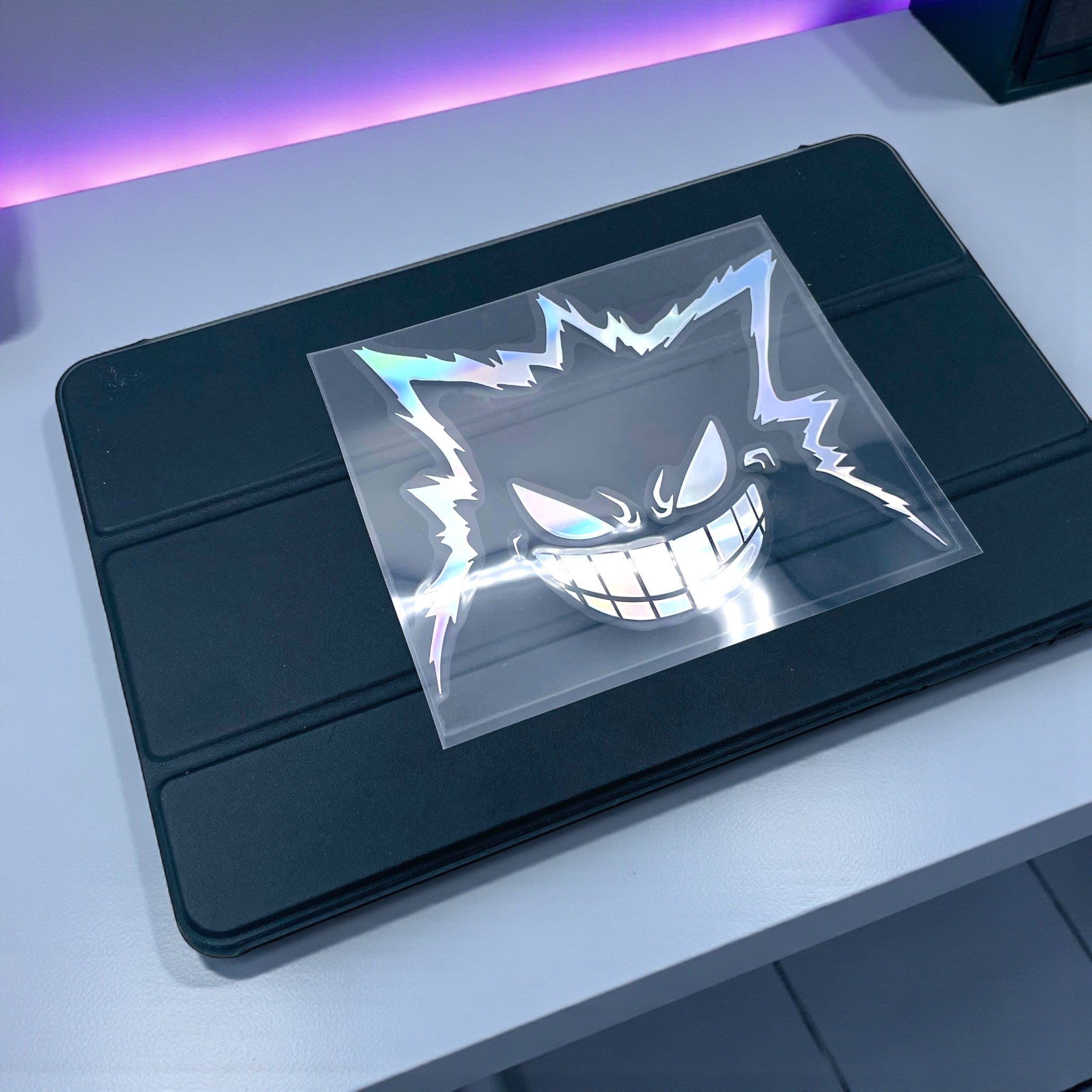 Holographic Gengar Vinyl Sticker Large Car Decal on an iPad