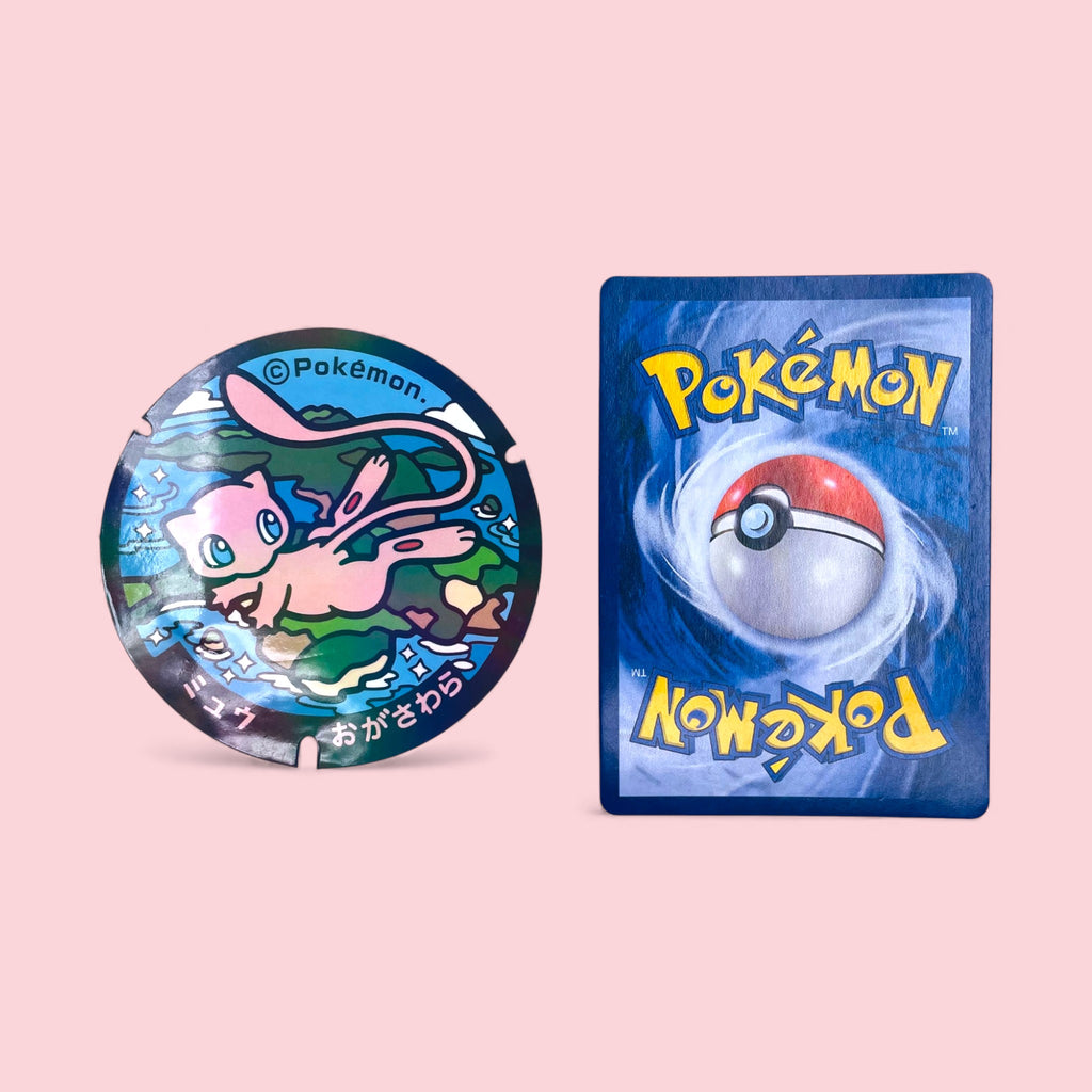 Large Mew Poke-Lid Vinyl Sticker (Ogasawara, Japan) next to Pokemon card