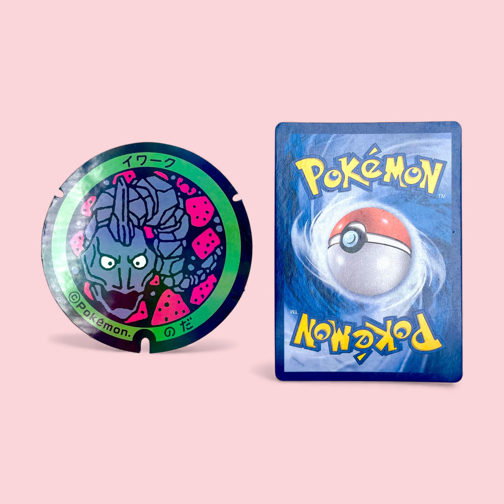 Onix Poke-Lid Holographic Sticker Noda Japan Collectible Decor next to Pokemon card