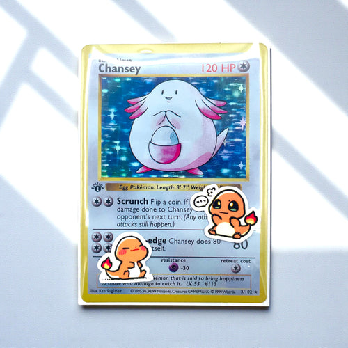 Charmander mini stickers decorating a Pokemon toploader card