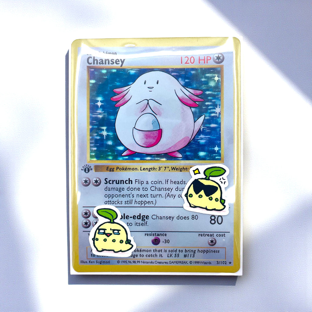 Chikorita chibi mini stickers decorating a photocard toploader