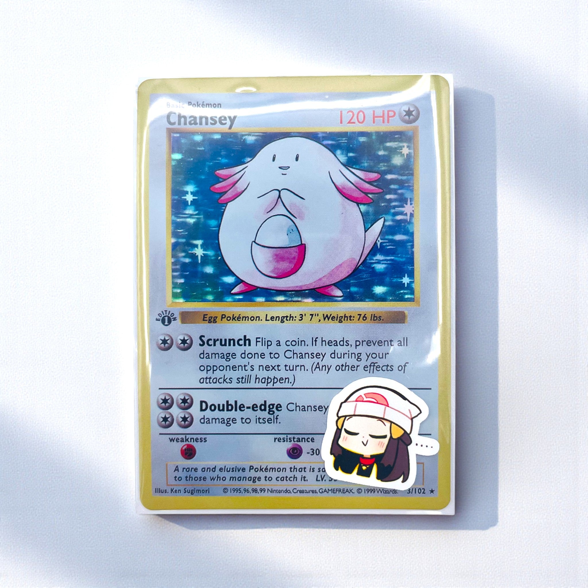 Dawn chibi trainer stickers decorating a photocard toploader