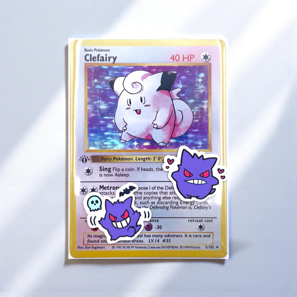 Gengar mini stickers decorating a Pokemon card toploader