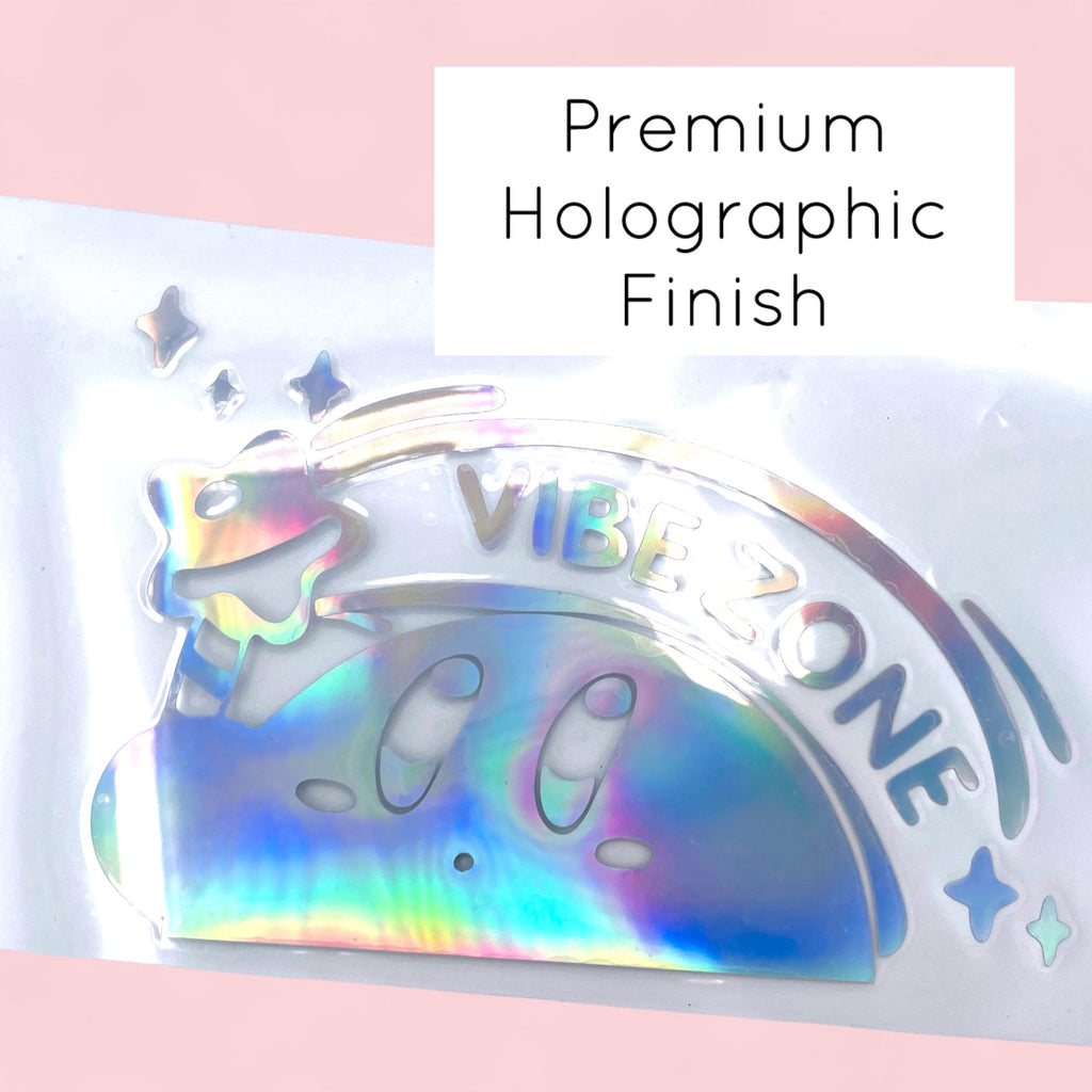 Close up of Kirby holographic vinyl decal with glossy rainbow sheen