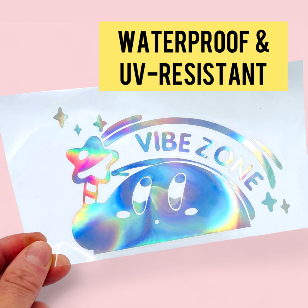 Kirby iridescent vinyl decal reflecting rainbow light under sunlight
