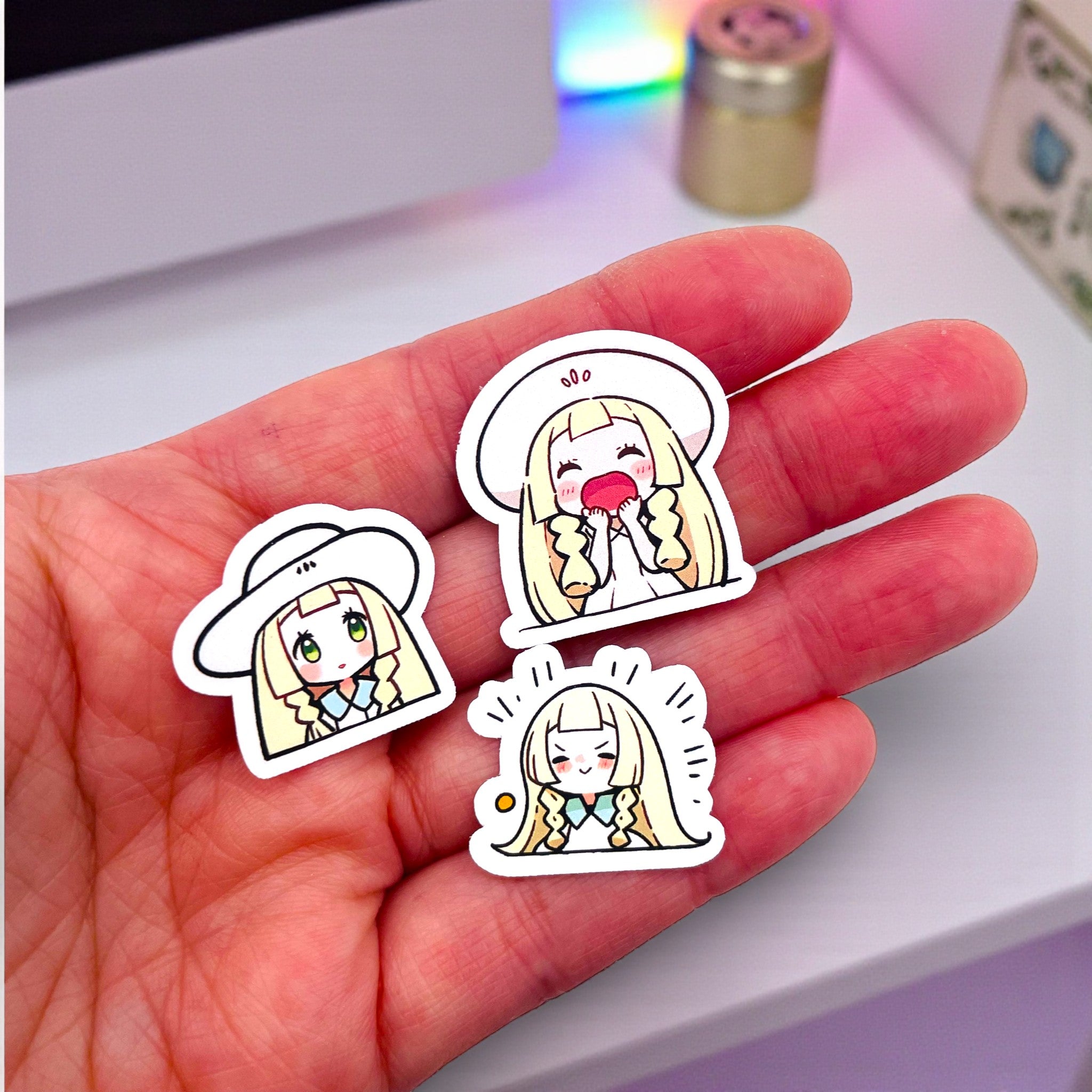 Close up of Lillie chibi trainer stickers with expressive pastel moods