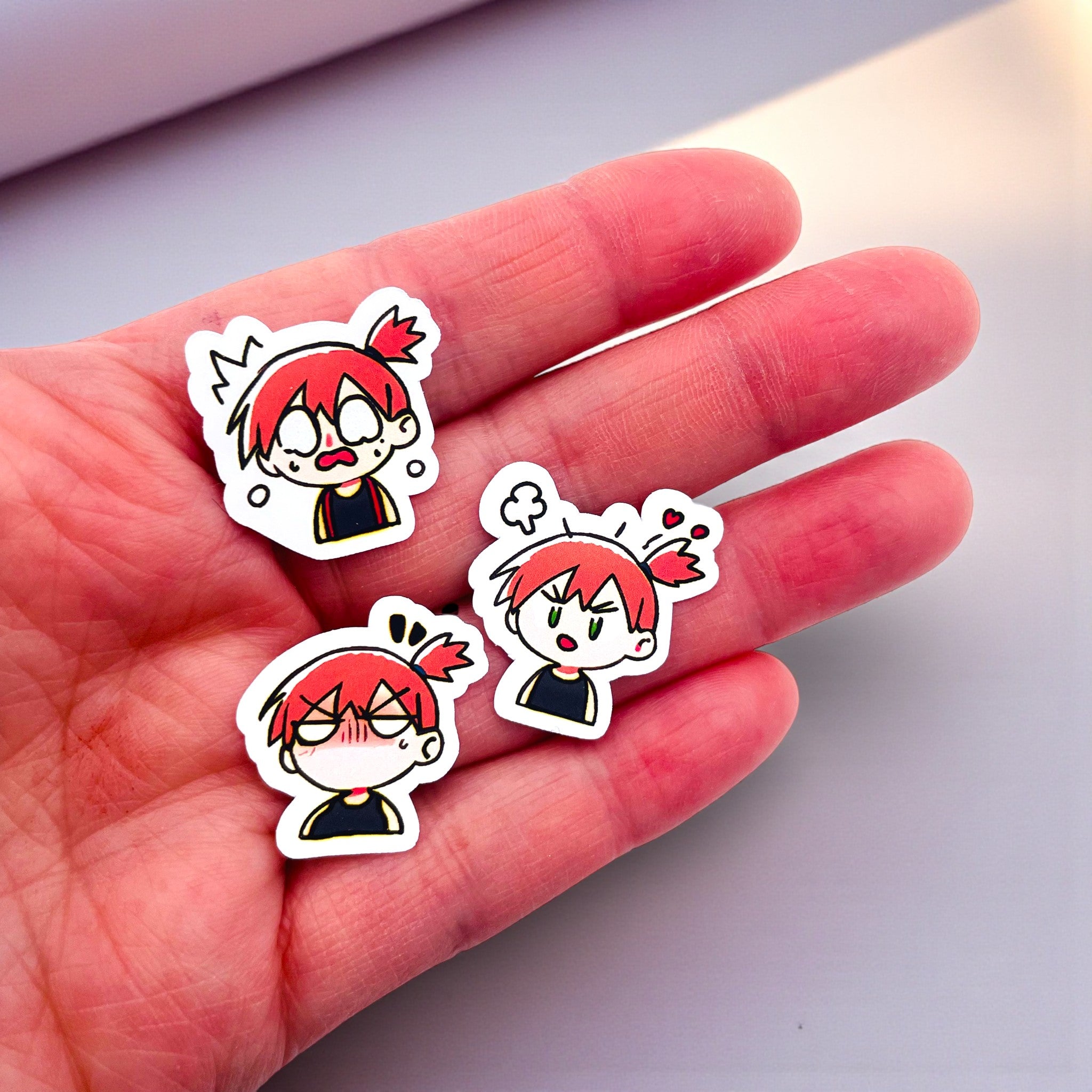 Close up of Misty chibi trainer stickers with expressive anime moods