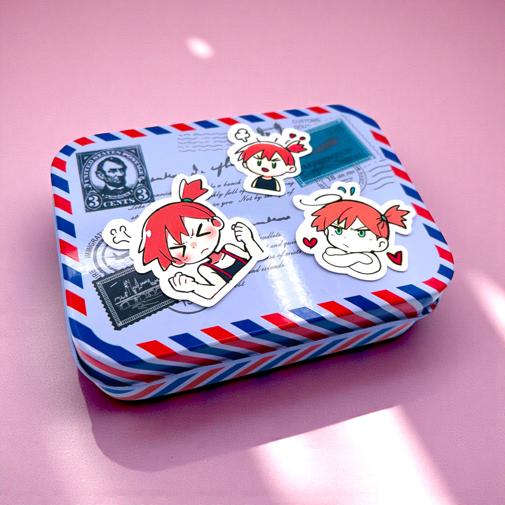 Misty chibi trainer stickers decorating a small tin